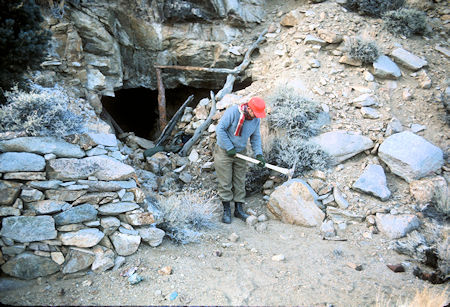Joe Cremi examines pick at entrance to a tunnel at Pat Keyes Mine