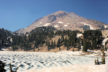 Lassen Peak behind ice covered Lake Helen