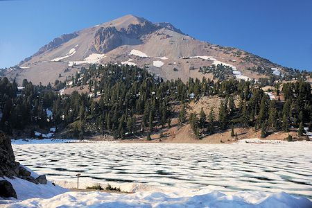 Lassen Peak over ice covered Lake Helen