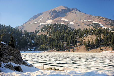 Lassen Peak behind ice covered Lake Helen