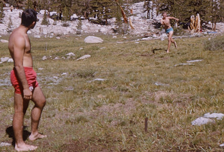 Playing 'horseshoes' with a stick at Whitney Creek - 20 Aug 1965