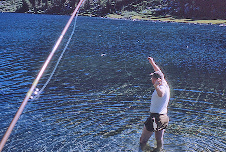 Bob Brooks retrieving hung up fishing line in Fourth Recess Lake - John Muir Wilderness 12 Aug 1962