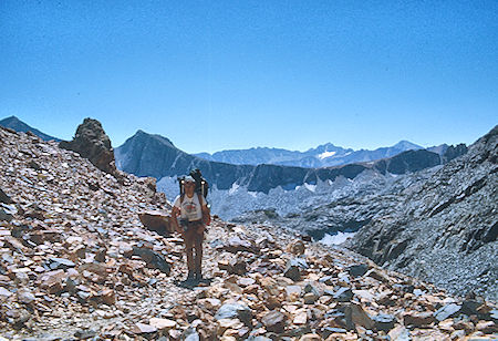 Mt. Crocker, Hopkins Pass, Mt. Mills (rear), Stan Haye on McGee Pass Trail - John Muir Wilderness 29 Aug 1976