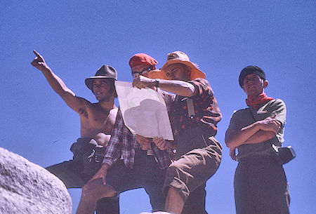 Richard Alvernez, Dale Caldwell, Gil Beilke, Tim McSweeney check the map on top of Fin Dome - Kings Canyon National Park 31 Aug 1970