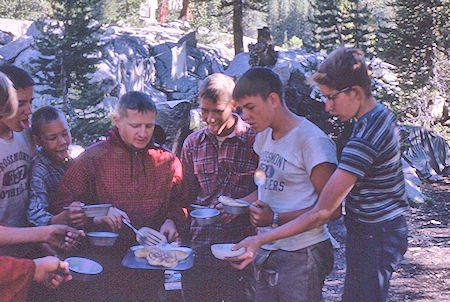 Bob Brooks feeding the mob at Hutchinson Meadow - John Muir Wilderness 17 Aug 1962