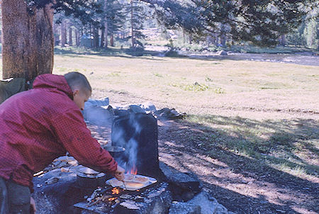 Bob Brooks cooking pancakes at Hutchinson Meadow - John Muir Wilderness 17 Aug 1962