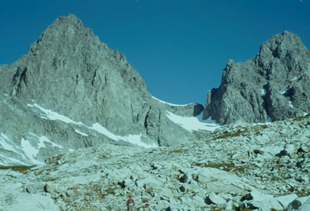 Mt. Ritter on left, Banner Peak on right on the approach from Lake Ediza to the saddle.  The route is on the snow through the notch on the right side of the saddle - Ansel Adams Wilderness - Jul 1960