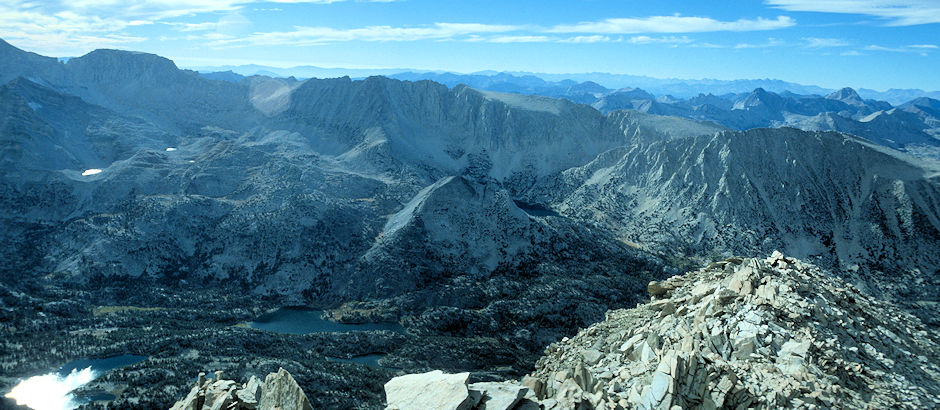 From the top of Mount Morgan in late afternoon, Mt Mills on the skyline; Ruby Lake and Mt Starr on the right; Chickenfoot Lake lower left; Long Lake lower center