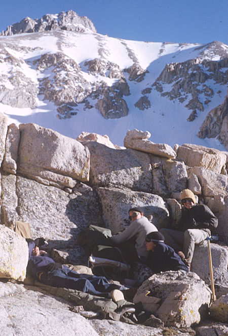 Making camp in the rocks at Meysan Lake, Mt. LeConte on the skyline above the route up - Jun 1963