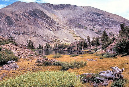 Shortly before arriving at Upper Sardine Lake the trail passes this pond. The high point on the left is at or near the top of Mt. Lewis