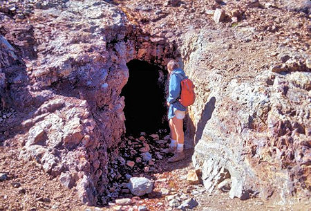 Kevin Twohey examines a mine tunnel near Mono Pass