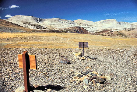 Looking westerly from Parker Pass you see the Kuna Crest. Helen Lake is located in the basin between the red and the gray rock on the left edge of the picture. There are also lakes in the two basins where you can see a small patch of snow