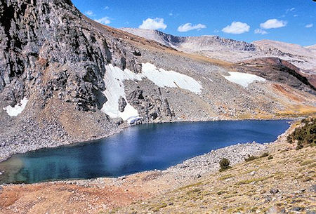 A short distance southwest of Parker Pass is Parker Pass Lake. Helen Lake is located behind the foreground ridge with the snow patches