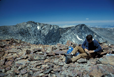Kuna Peak on the left.  Stan Haye is checking out the register on Koip Peak