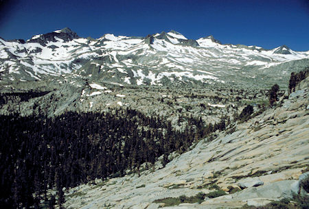 From the edge of the Lost Lake plateau, looking southwest over the terrain that one would cross contouring over to the John Muir/Pacific Crest trail. The high peak on the left is Rogers Peak and Mt. Lyell is the high peak just to the right of center. Donohue Pass is near the right edge of the picture