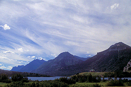 View over Prince of Wales Hotel and Waterton Lake at nearby mountains