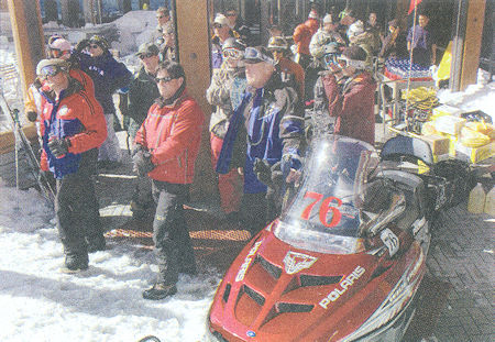 Volunteers, who appeared out of the blue, and mountain employees wait to be called out to the site - Susan Morning Photo