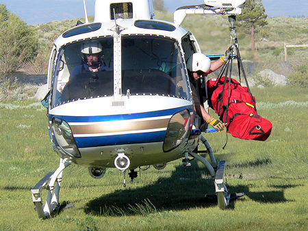 Unloading subject from CHP helicopter