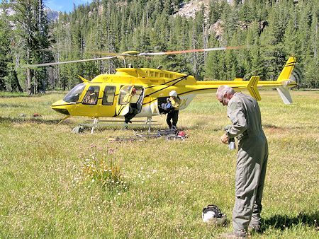 Forest Service contract helicopter delivers team to camp area