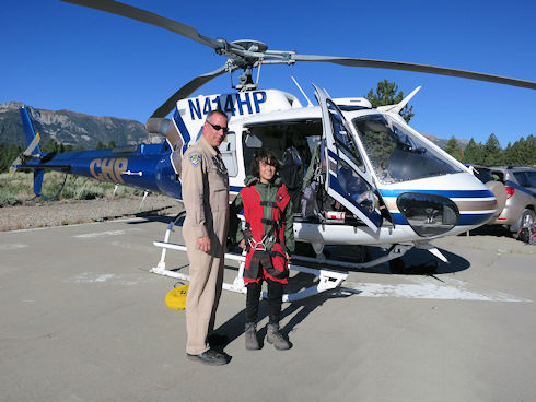 Boy Scout poses with helicopter pilot
