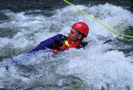 Pete DeGeorge practicing swiftwater rescue techniques