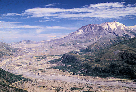 Mount St. Helens and river valley from Elk Rock viewpoint, Mt. Adams on left skyline, near Coldwater Visitor Center, Mount St. Helens National Volcanic Monument, WashingtonMount St. Helens and river valley from Elk Rock viewpoint, near Coldwater Visitor Center, Mount St. Helens National Volcanic Monument, Washington